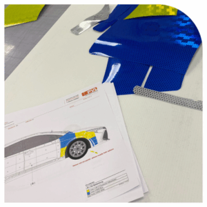 Image of a template and materials used for PVLs vehicle wrapping service